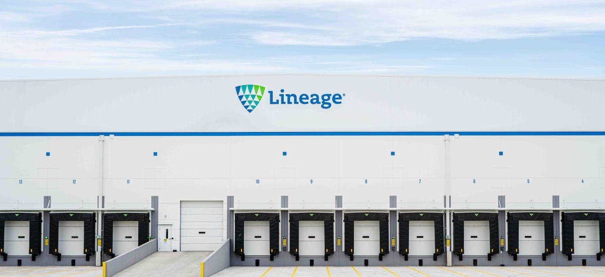 The exterior of a Lineage cold storage warehouse shows several dock doors